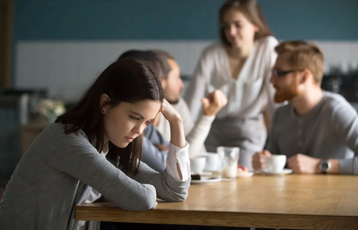 Sad young girl feeling lonely sit alone
