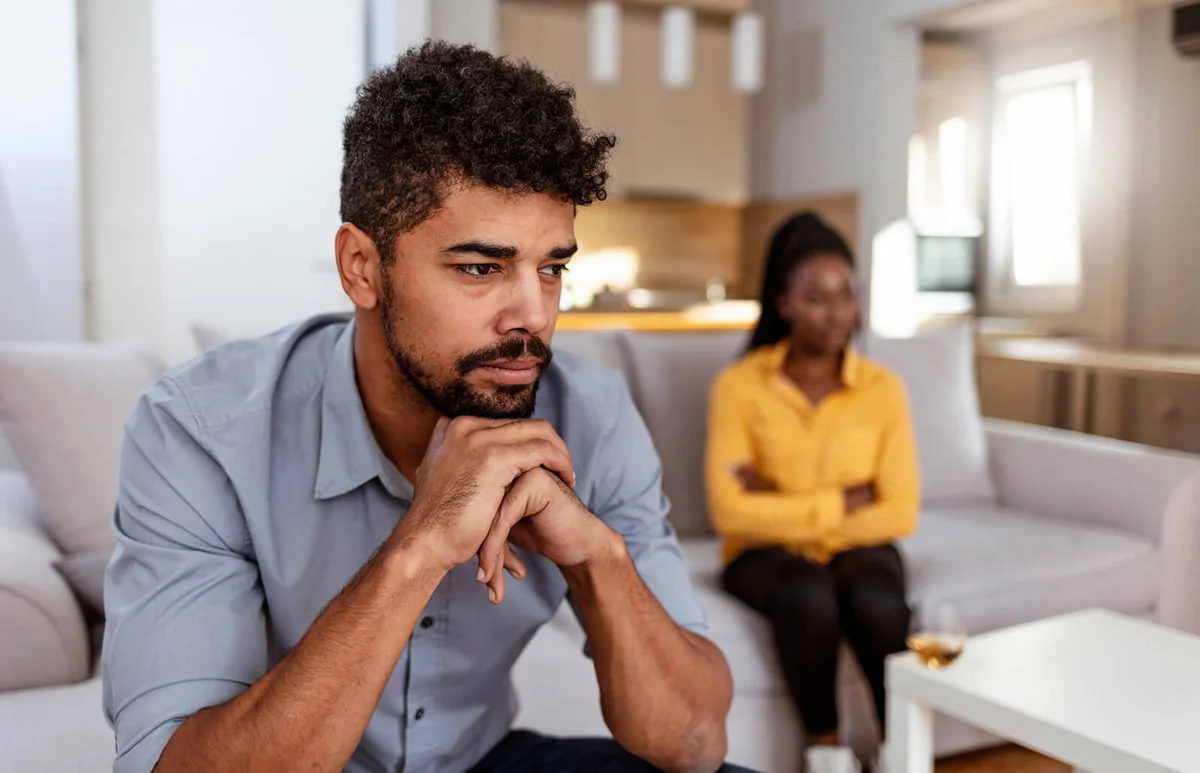 couple sitting together not looking at each other