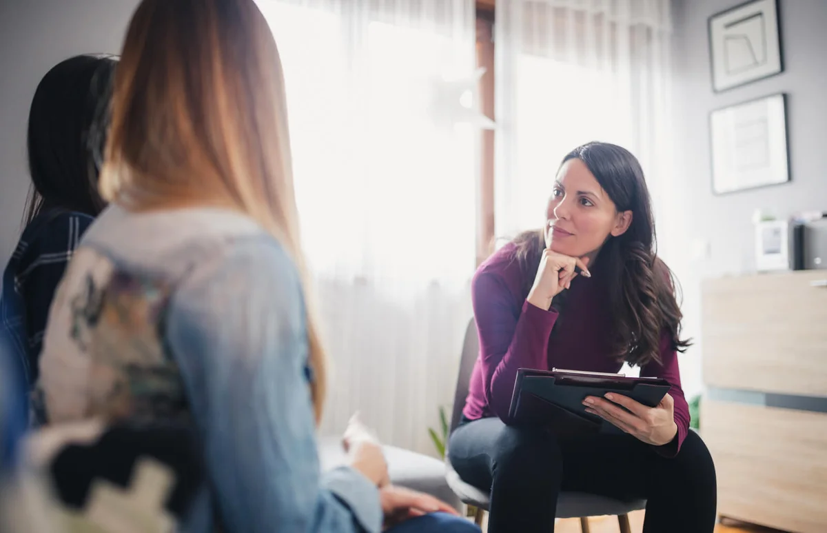 counselor advising young lesbian couple