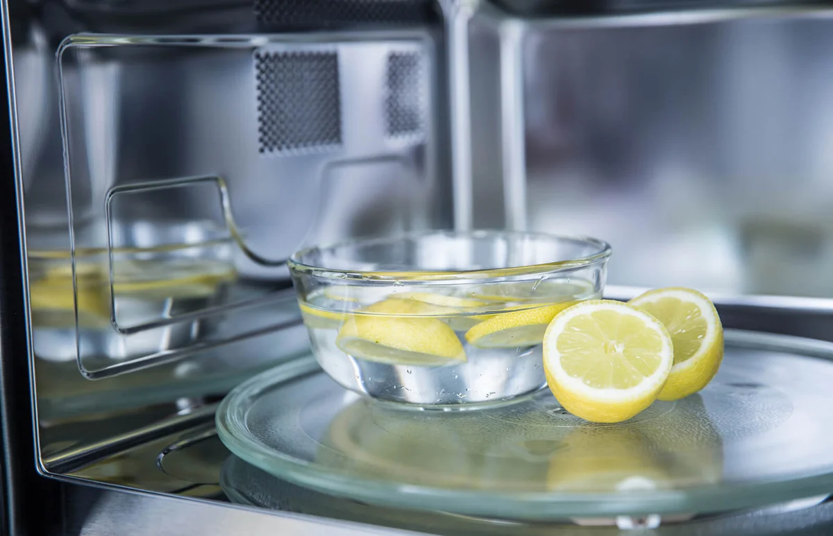 cleaning in a microwave oven with water and lemon