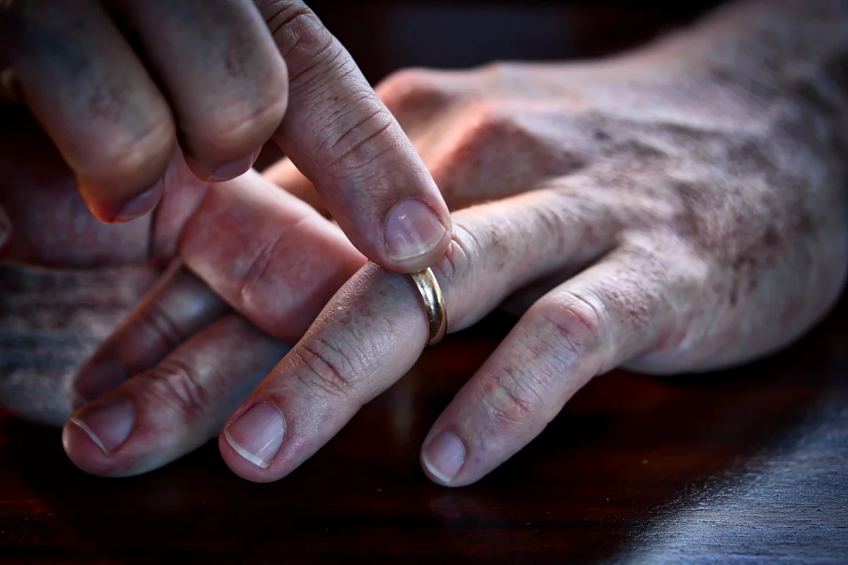 Middle Aged Man Taking His Wedding Ring Off