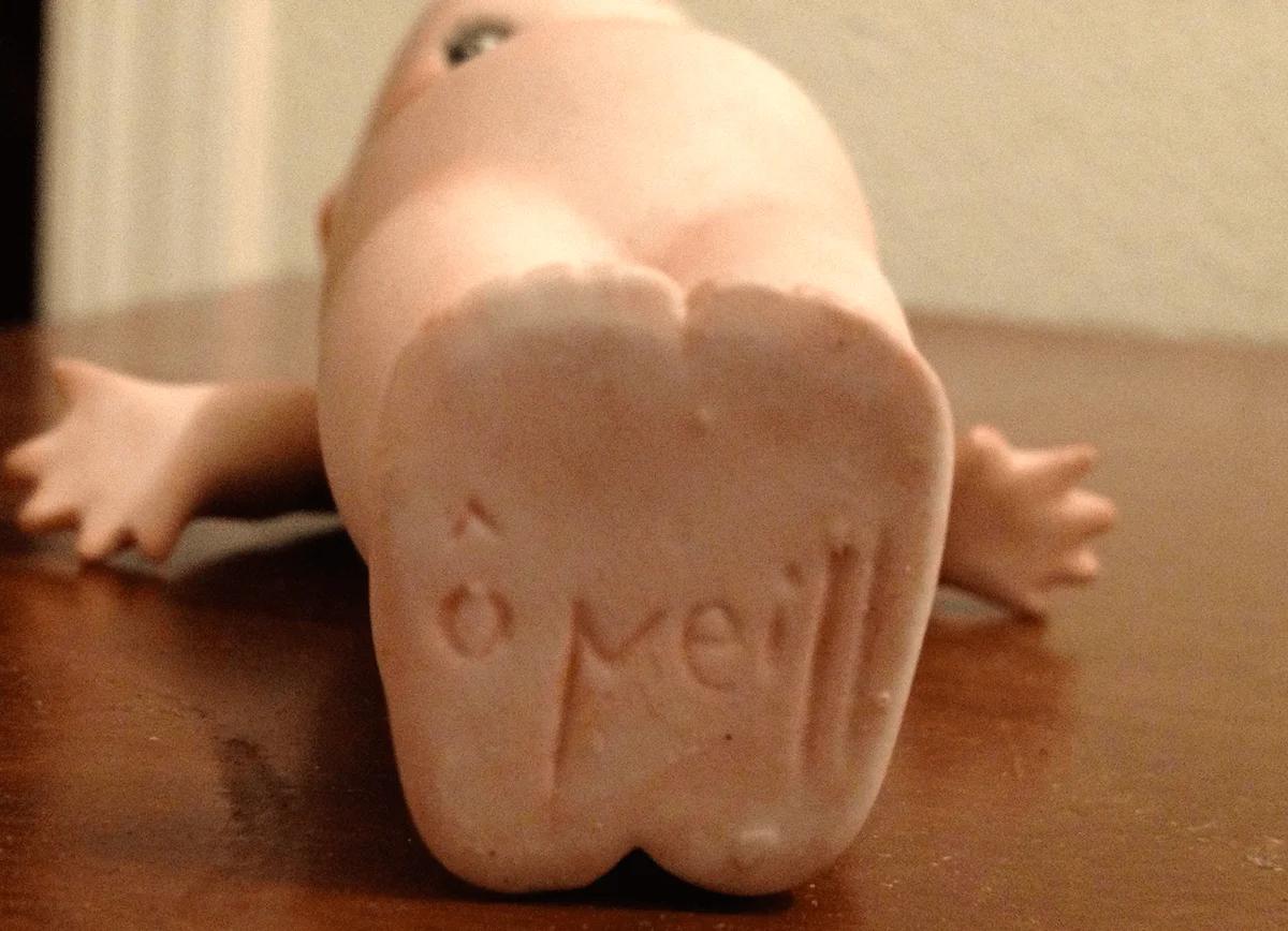 Signature on bottom of 1912 Kewpie doll's feet