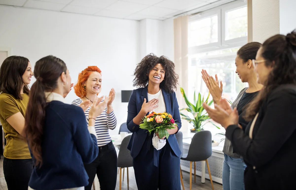 Businesswomen celebrating an achievement of a colleague