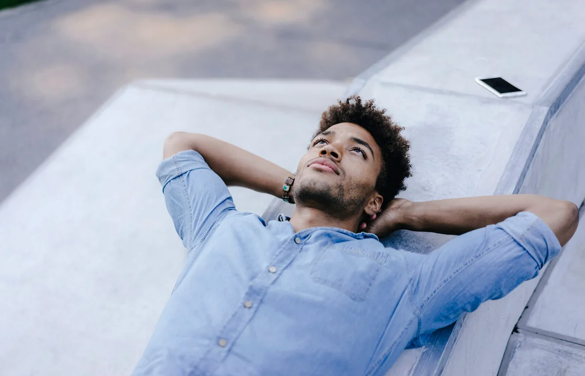 relaxed man lying in skatepark