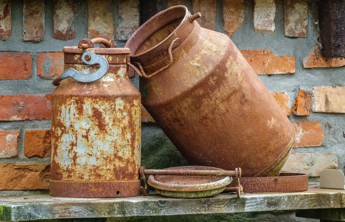Rusty old milk canister on a farm