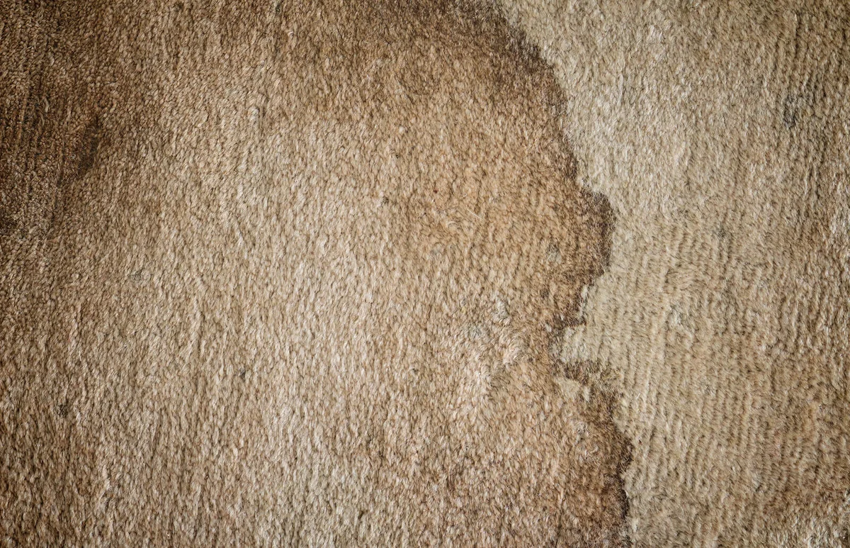 The texture of old dirty doormat with stain