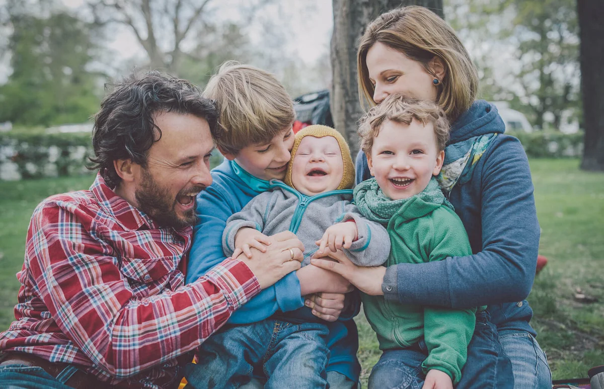 Happy family having fun in park