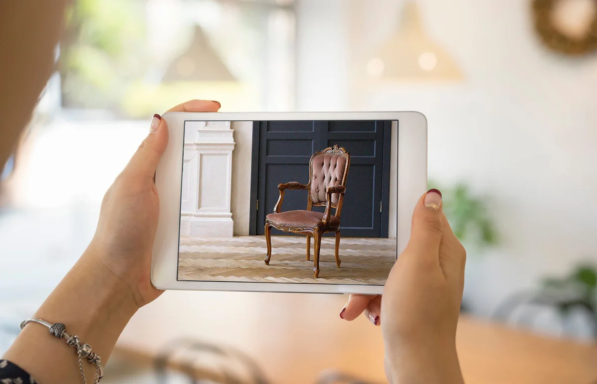 Woman taking photo at antique furniture