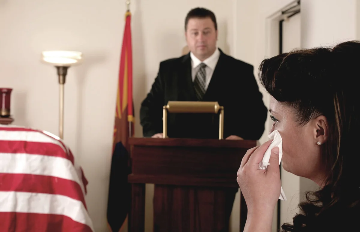 Woman mourning a hero's death at a funeral