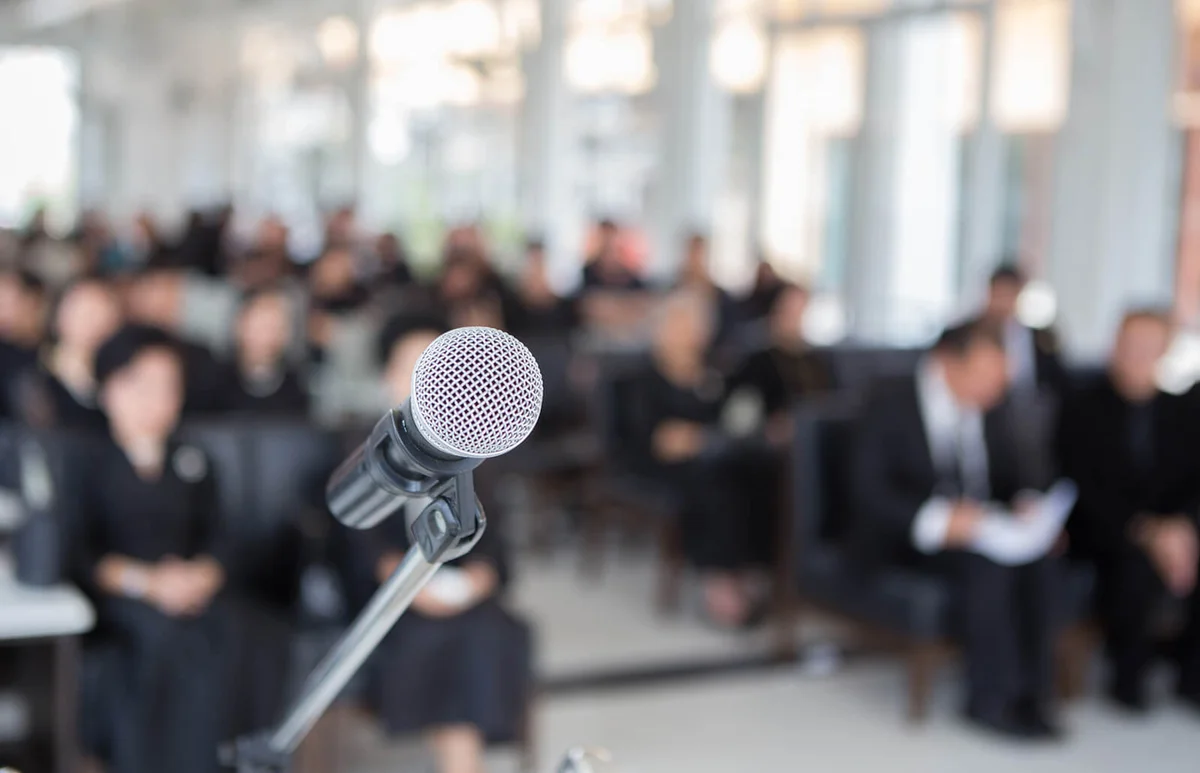 Microphone against people sitting in church
