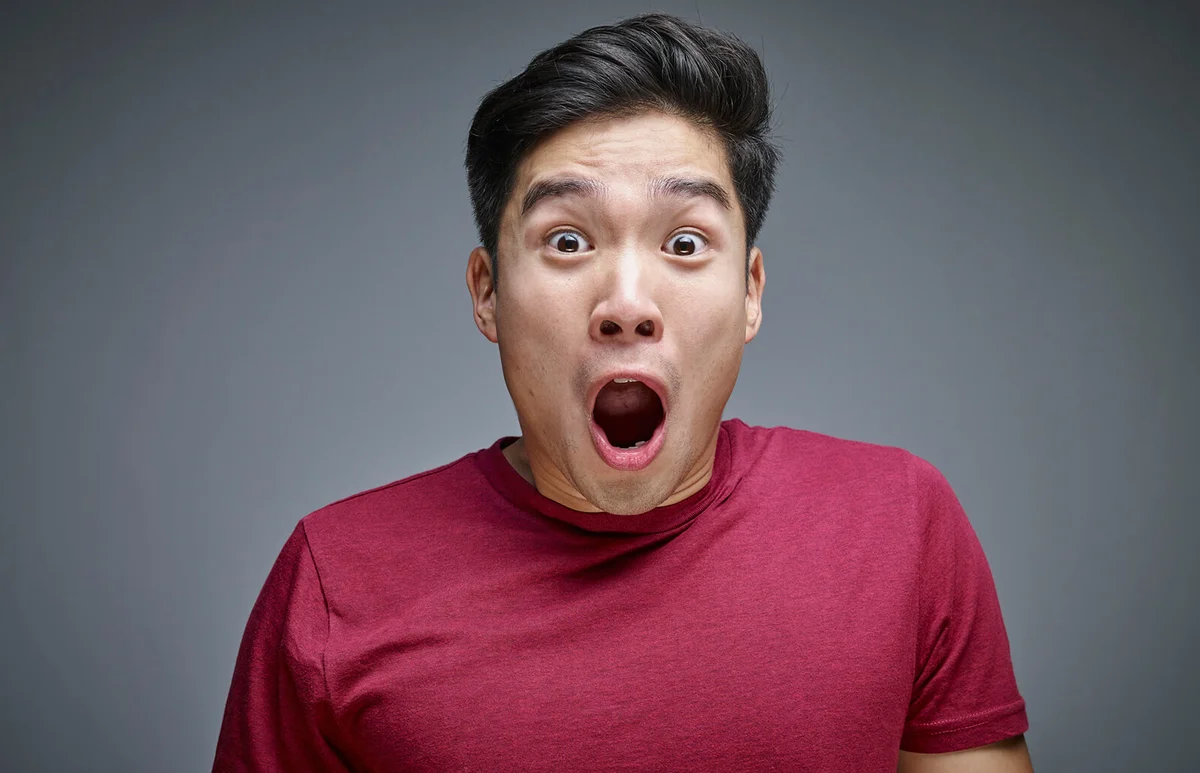Portrait of shocked young man