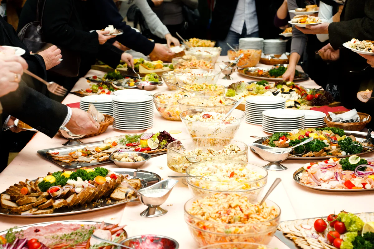 Catering table full of tasty food