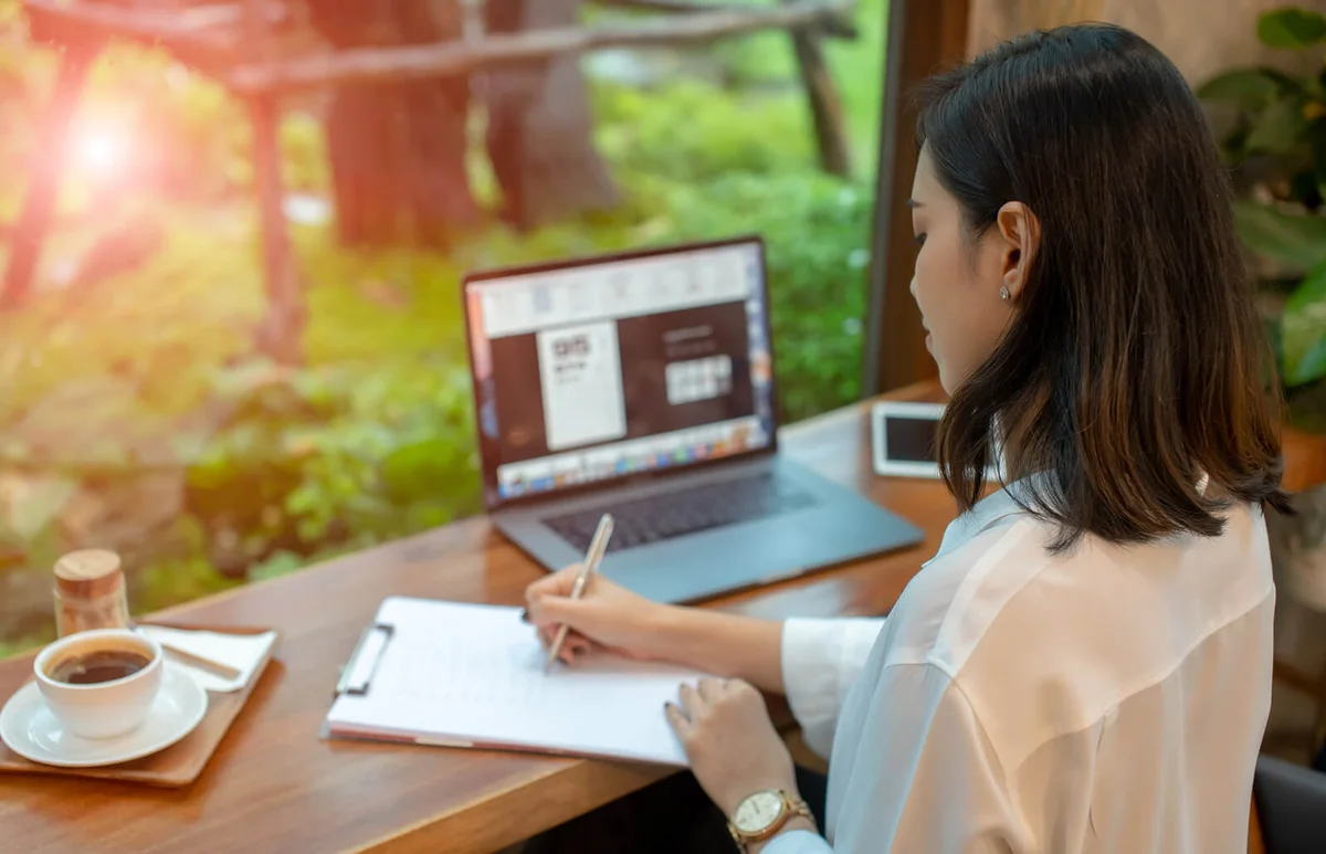 Woman writing eulogy for her brother