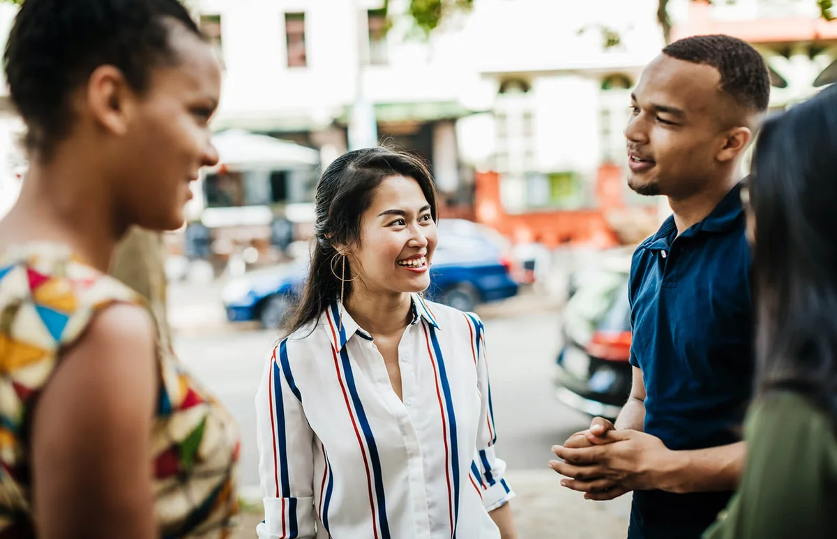 woman listening to her friends talking