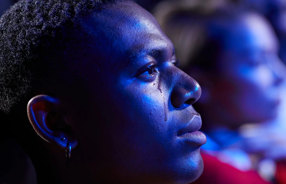 man crying while watching movie