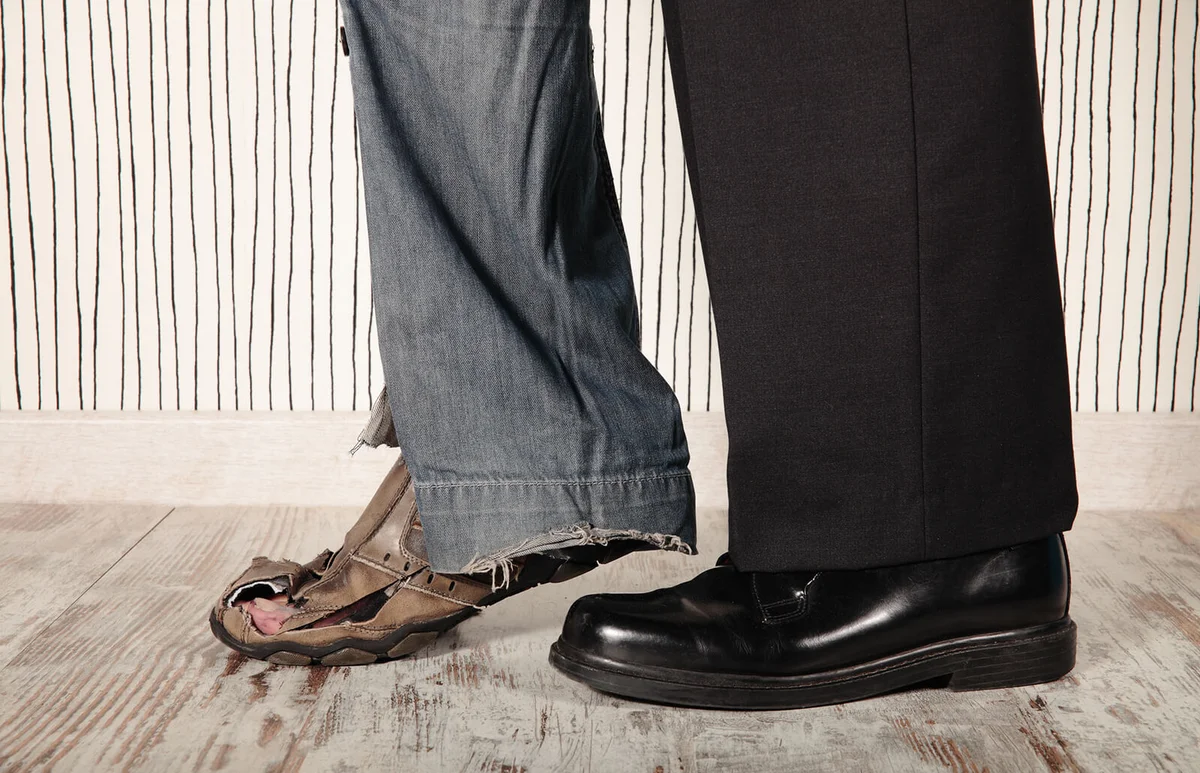 Man wearing jeans and trouser while walking on floor