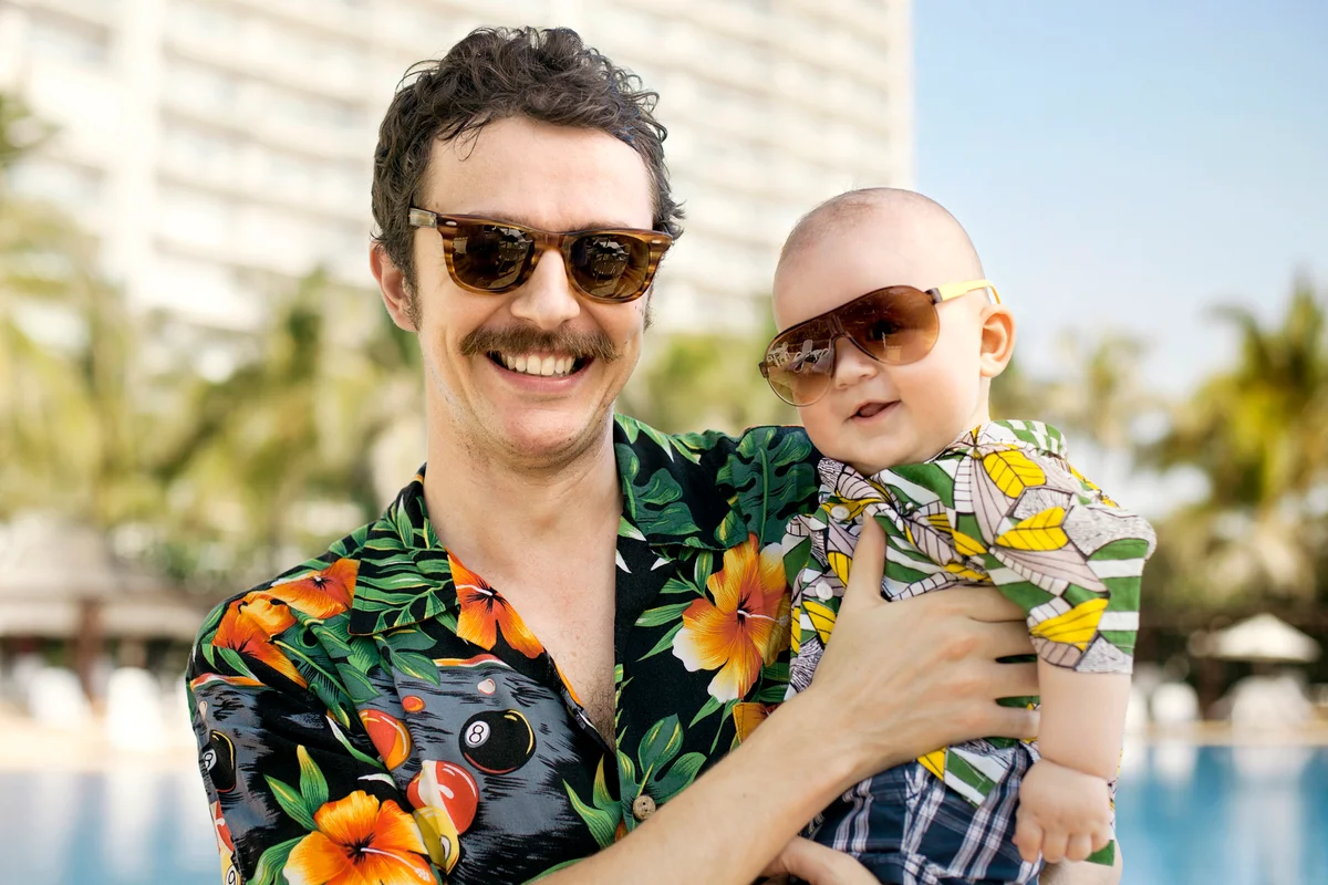 Father and his son with hawaian shirts