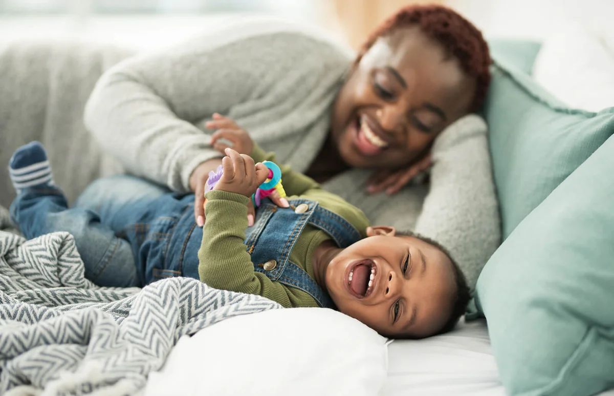 mother playing with her adorable baby boy