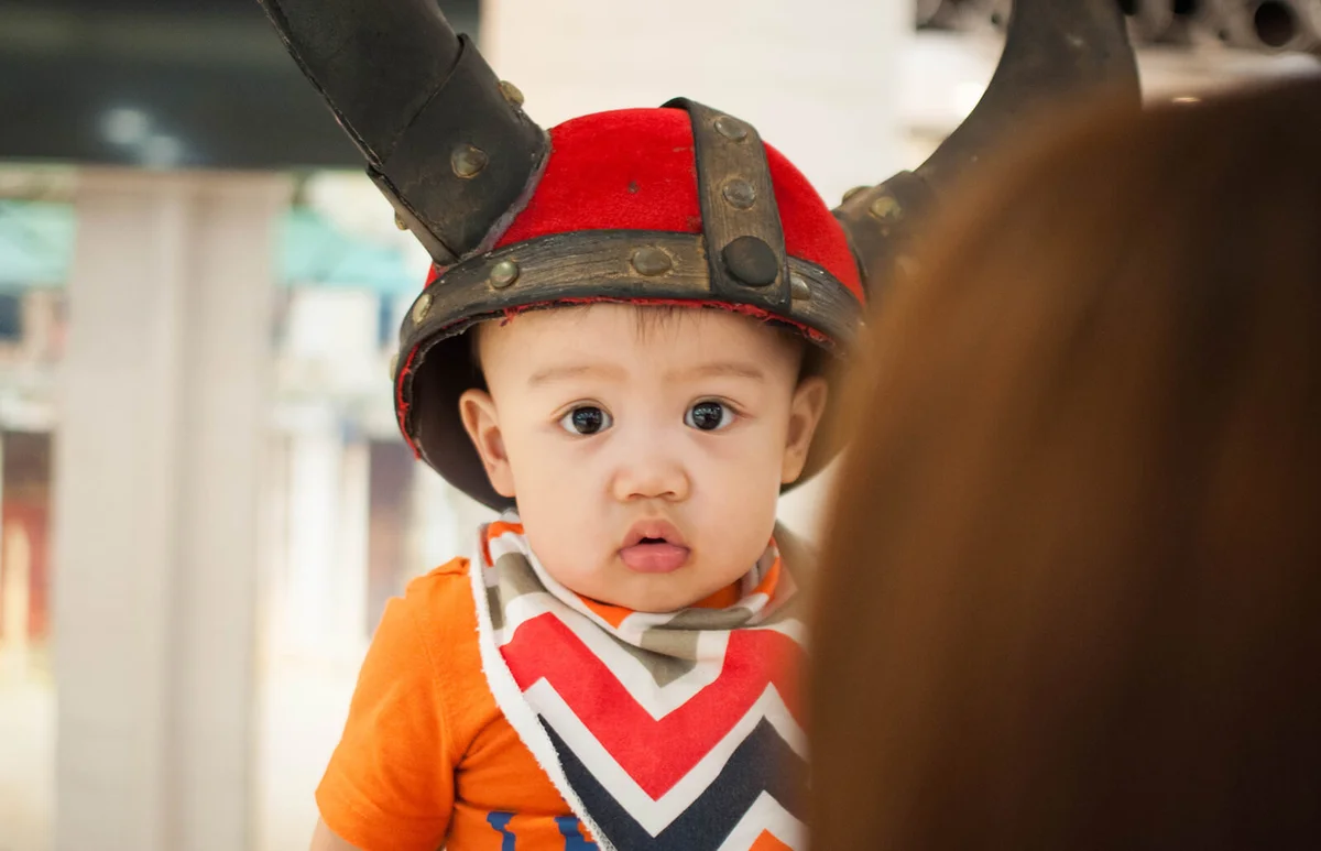 baby boy wearing a viking hat