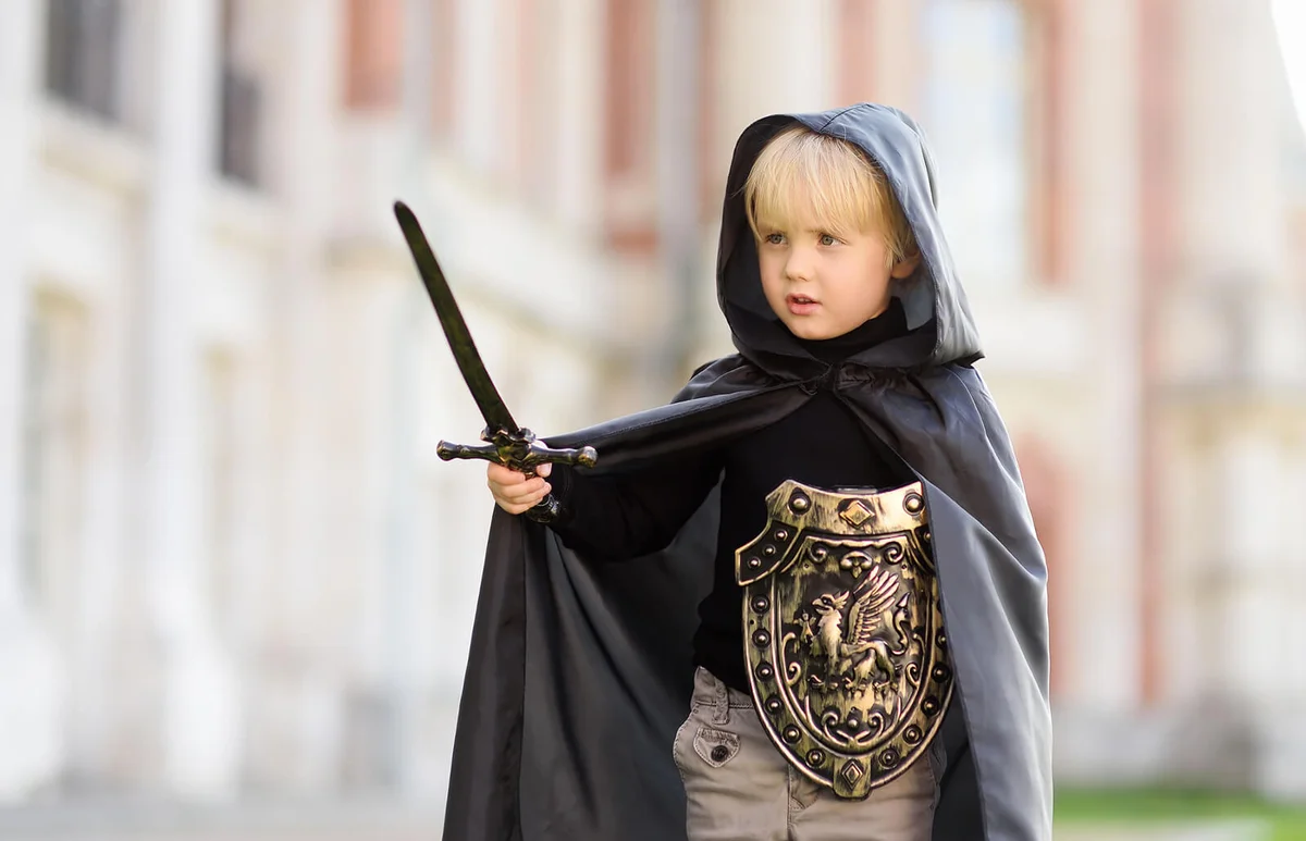 cute little boy dressed as a medieval knight