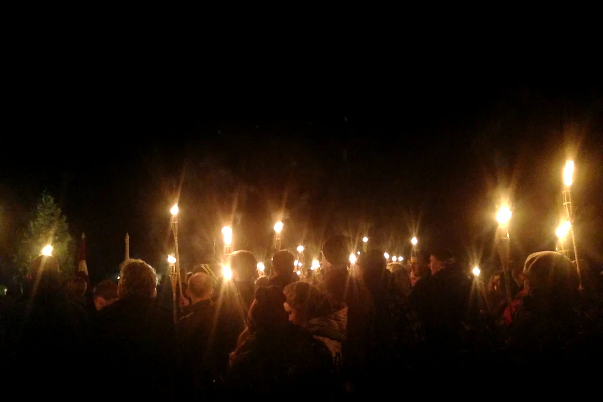 Gathering of people with torches