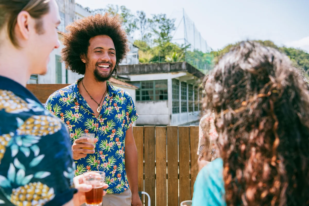 Man wearing Hawaiian Shirt celebration of life outdoor party