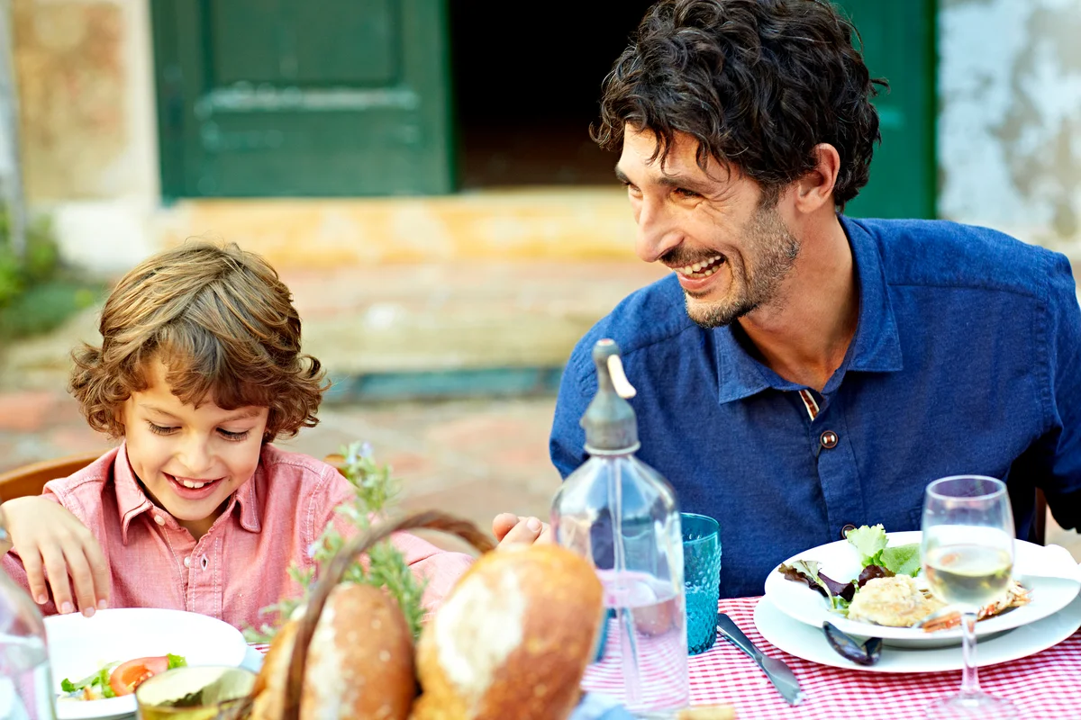 Father and son outdoor dinner for celebration of life