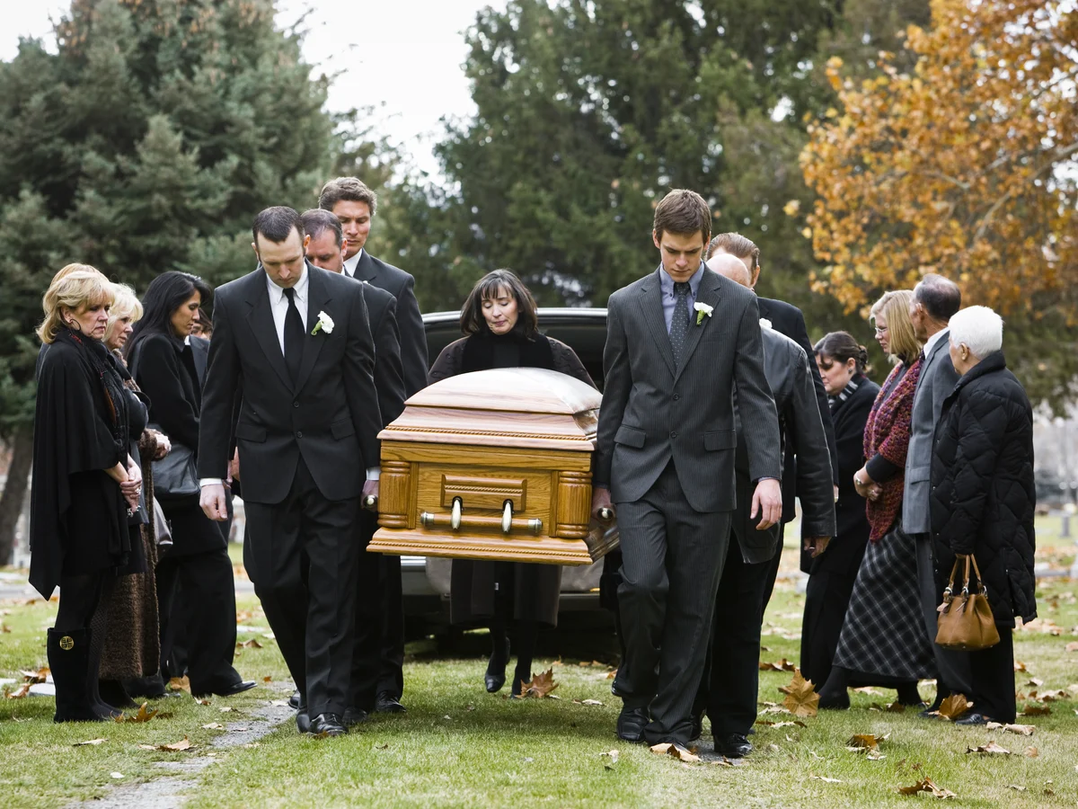 Pallbearers carrying casket