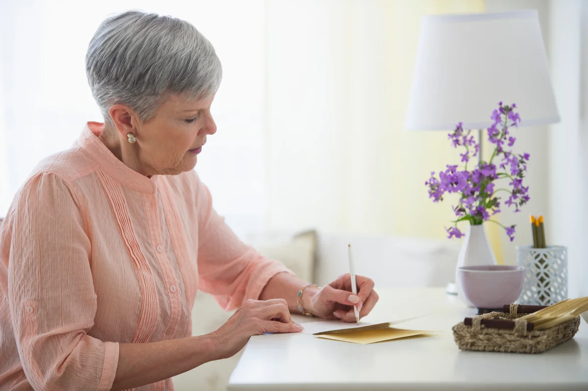 Woman writing sympathy card