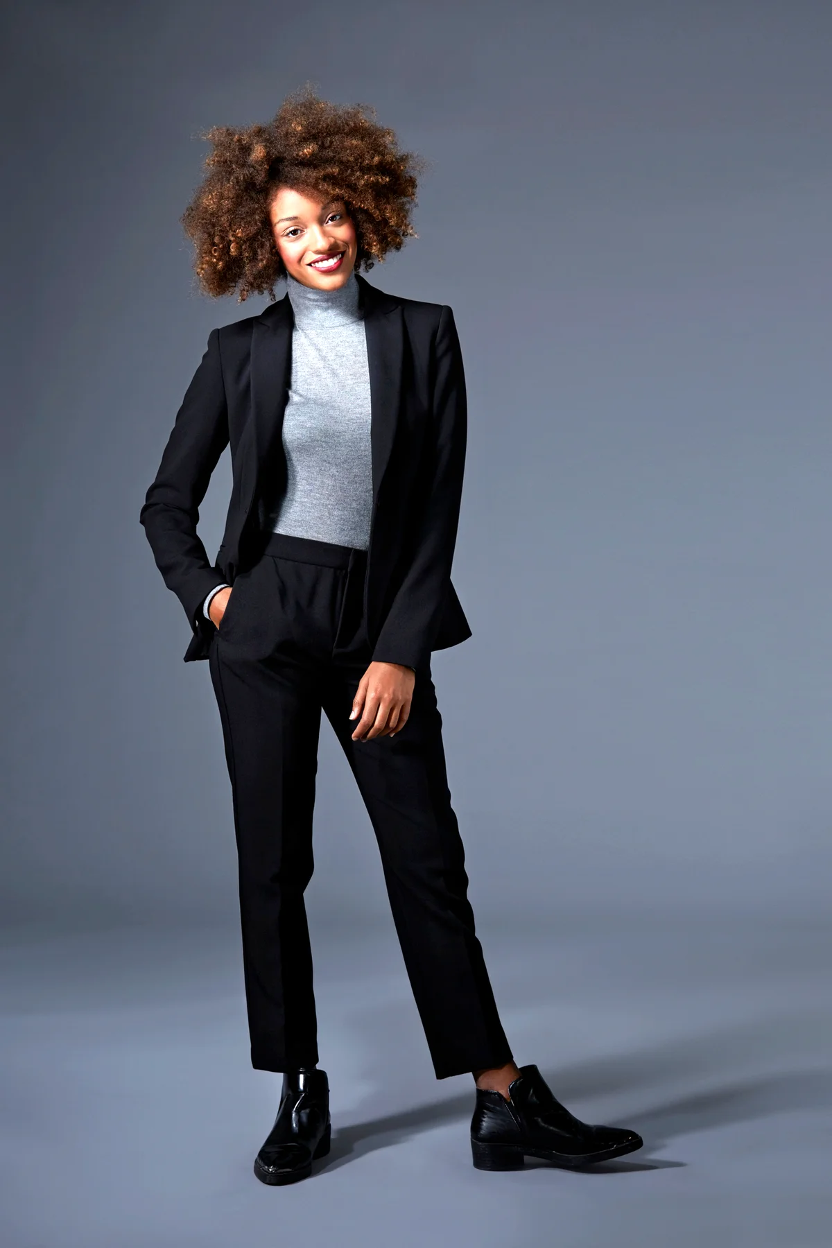 Woman wearing a black power suit