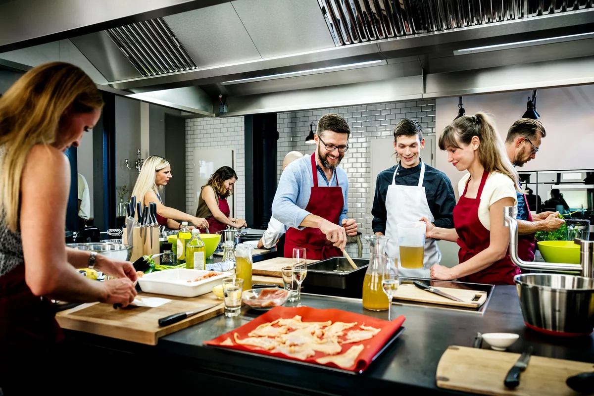 Chef assisting a cooking class