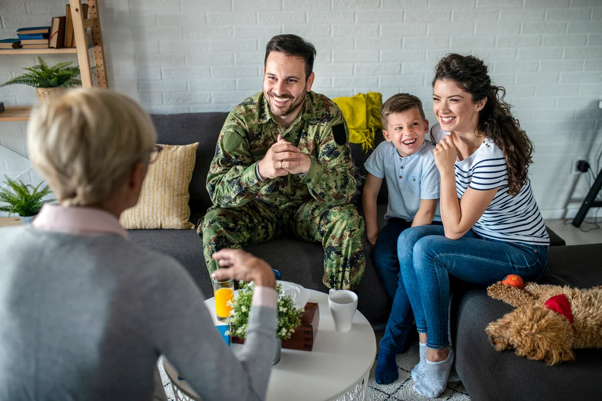 A soldier and his family at a psychotherapist during a session