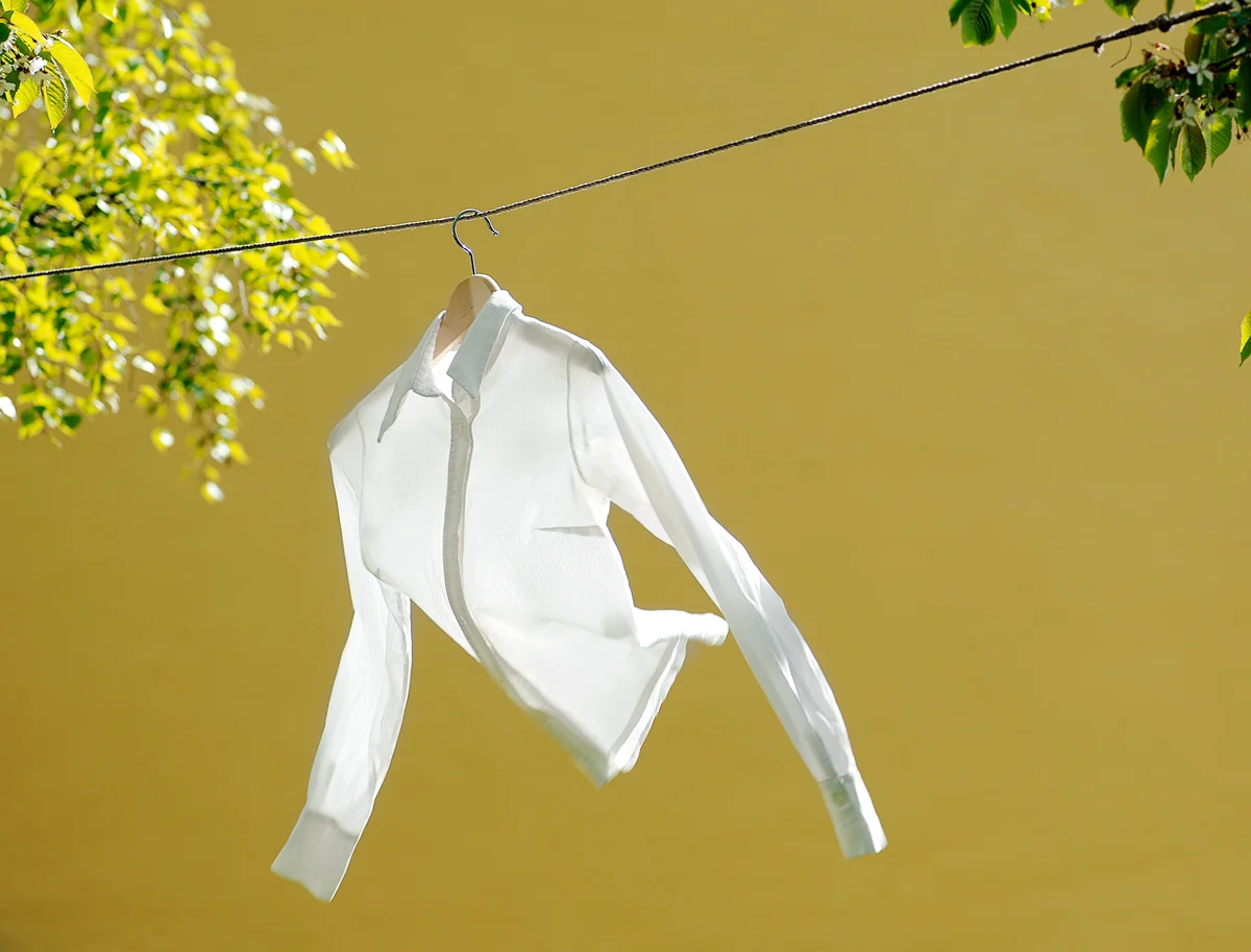 White shirt hanging on line