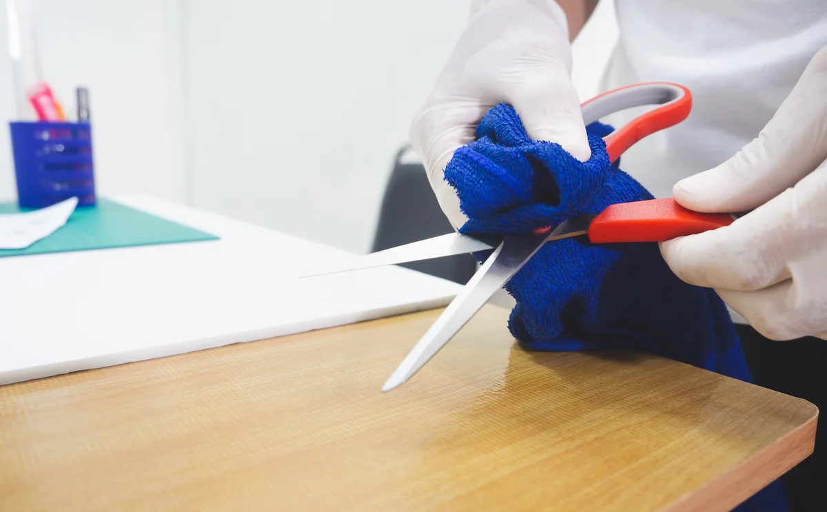 Cleaning Scissors with a cloth