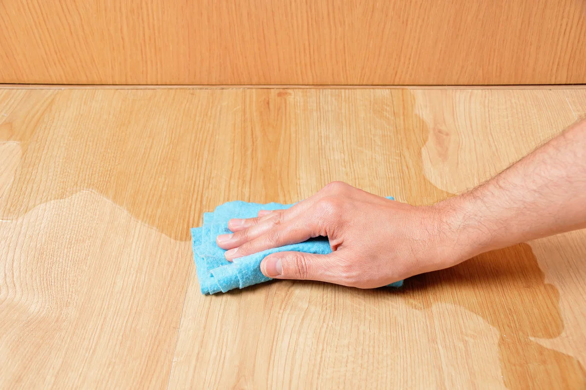 Wiping wooden laminate parquet floor