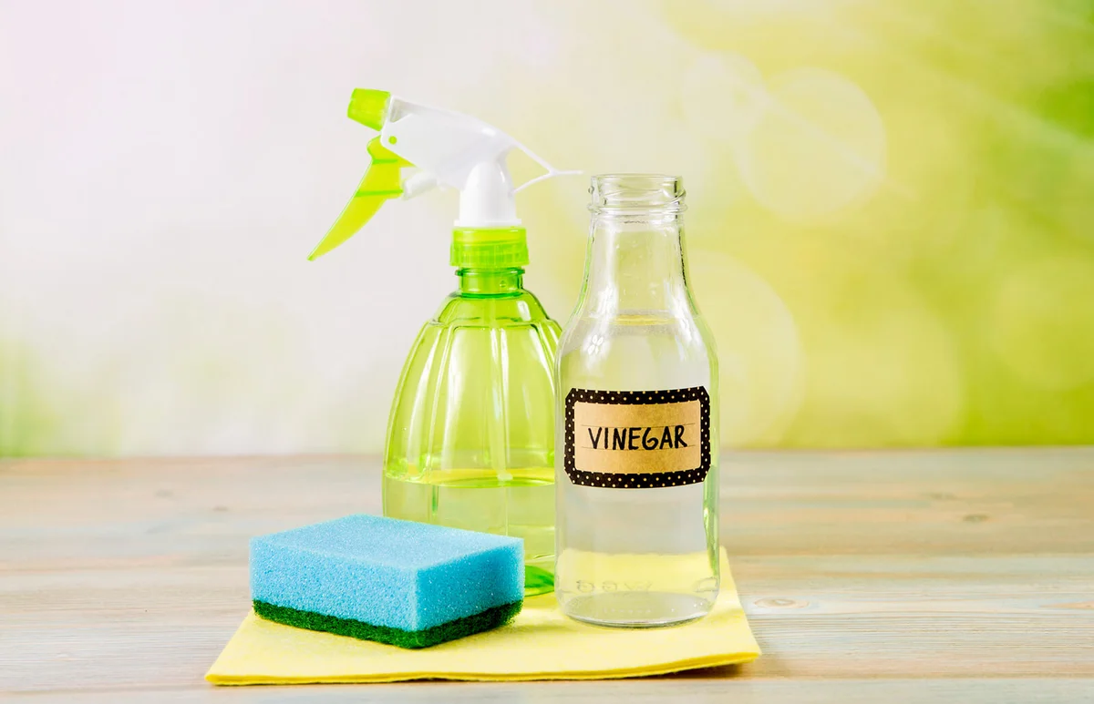 Using natural distilled white vinegar in spray bottle to remove stains