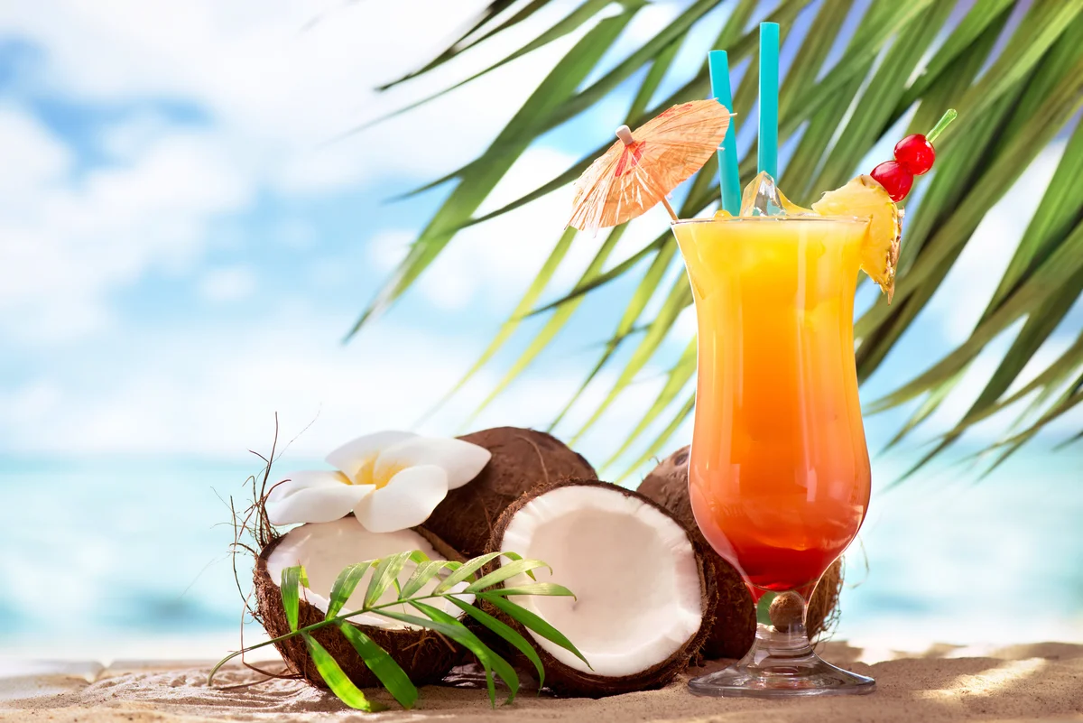 Coconut sunrise cocktail on the beach