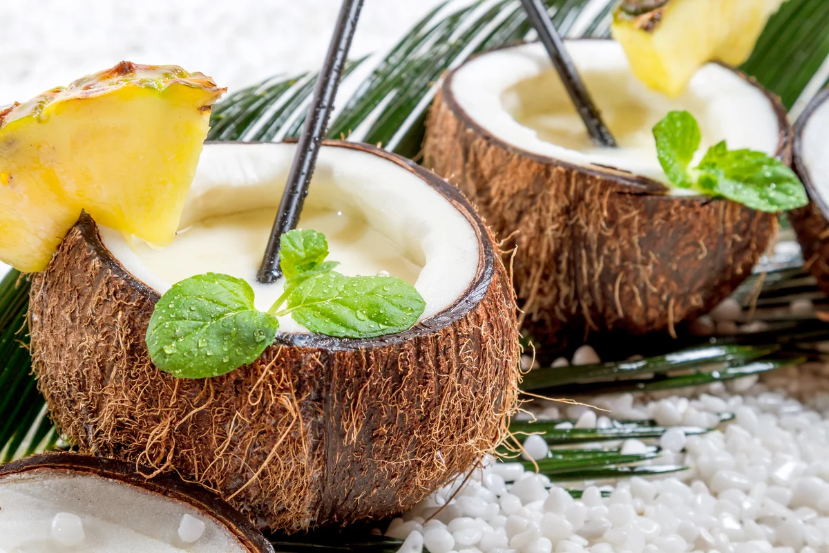 Pinacolada cocktail in a fresh coconut