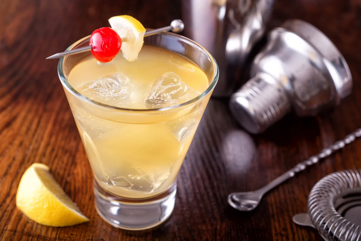 Frangelico sour cocktail on a wooden bar counter top