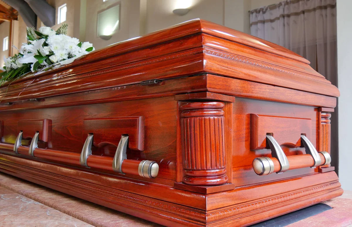 Flowers on wooden coffin