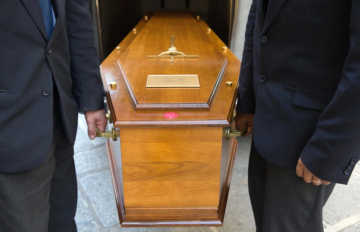 People carrying coffin