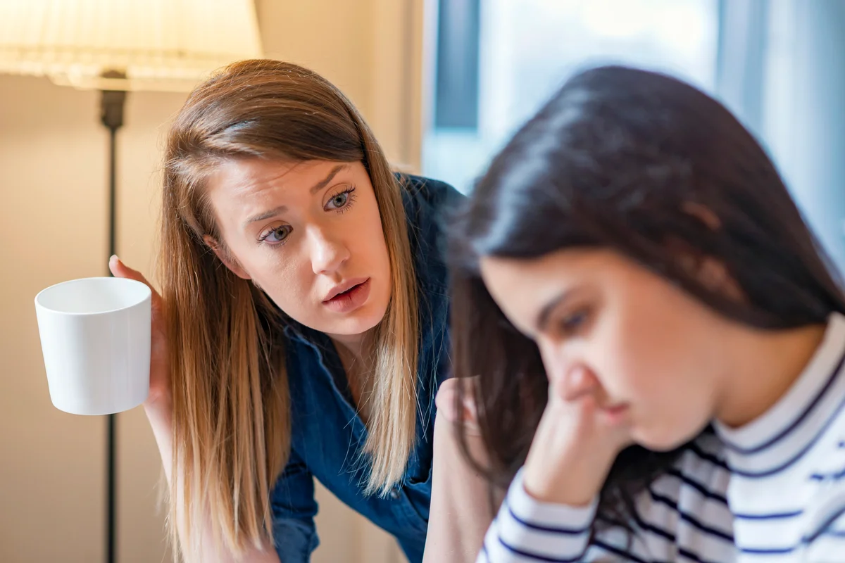 Mother And Teenage Daughter Arguing At Home