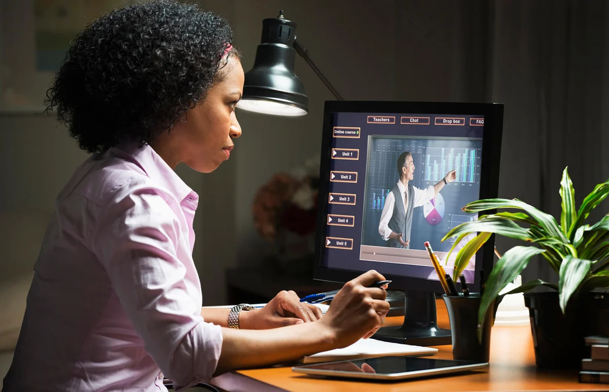 businesswoman taking online class on computer