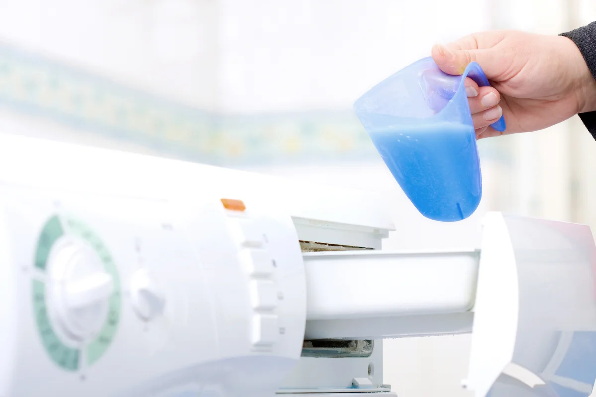 Pouring too much detergent in washing machine
