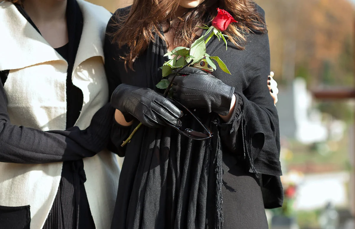 Mother and daughter at cemetery