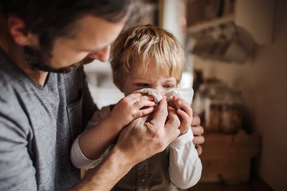 Dad looking after his small son
