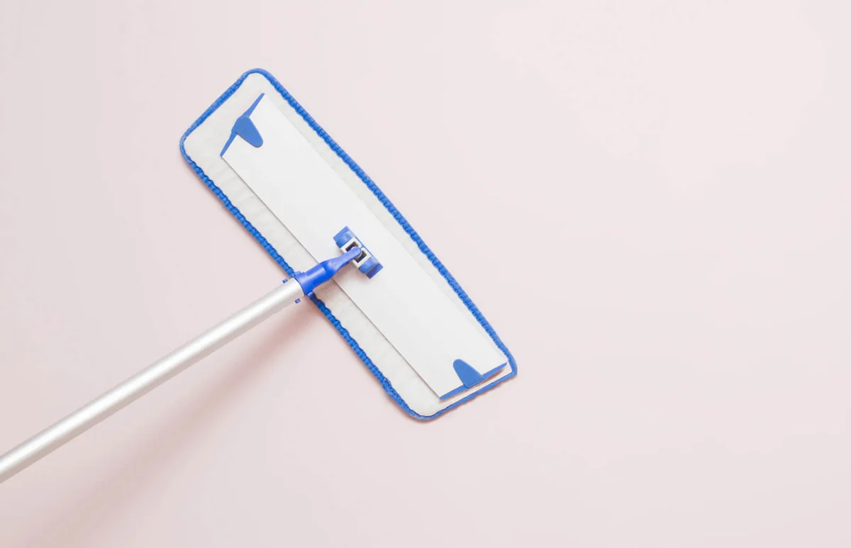 mop on the wall wiping a dust in the room