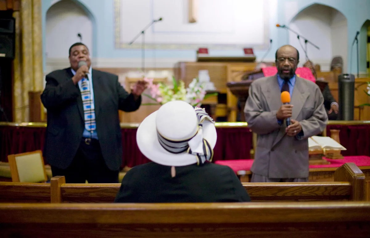 Men singing in church funeral