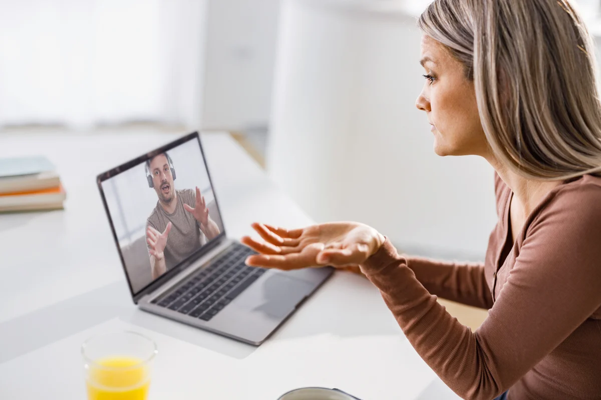 Displeased woman having a video call with her boyfriend