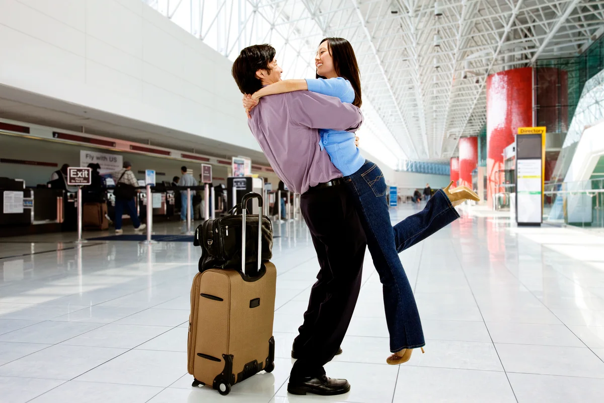 Couple hugging in airport